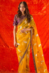Buy beautiful bright yellow embroidered organza saree online in USA. it comes with purple embroidered saree blouse. This elegant piece gets it look from its heavy border. Be the talk of parties and weddings with exquisite designer sarees  from Pure Elegance Indian clothing store in USA. Shop online now.-full view