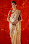 Buy beautiful golden embroidered handloom saree online in USA. Saree is crafted with fine embroidery and thick heavy border. saree comes with red colored blouse. Be the talk of parties and weddings with exquisite designer sarees from Pure Elegance Indian clothing store in USA.Shop online now.-full view