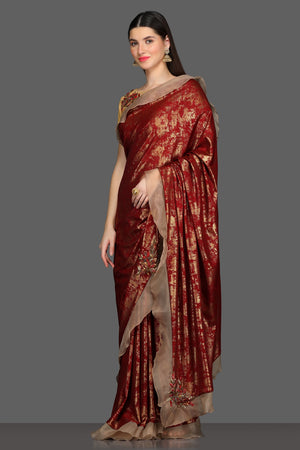 Shop gorgeous maroon and golden fancy ruffle saree online in USA with golden embroidered saree blouse. Make a fashion statement at weddings with stunning designer sarees, embroidered sarees with blouse, wedding sarees, handloom sarees from Pure Elegance Indian fashion store in USA.-side