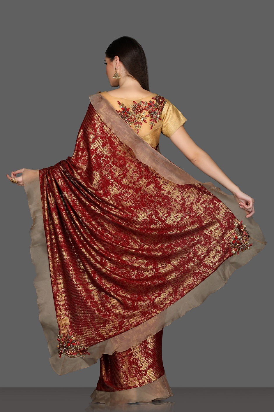 Shop gorgeous maroon and golden fancy ruffle saree online in USA with golden embroidered saree blouse. Make a fashion statement at weddings with stunning designer sarees, embroidered sarees with blouse, wedding sarees, handloom sarees from Pure Elegance Indian fashion store in USA.-back