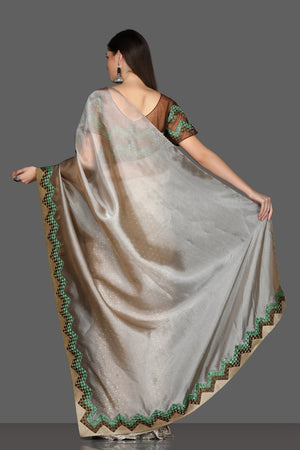Shop beautiful golden embroidered border organza saree online in USA with embroidered saree blouse. Make a fashion statement at weddings with stunning designer sarees, embroidered sarees with blouse, wedding sarees, handloom sarees from Pure Elegance Indian fashion store in USA.-back