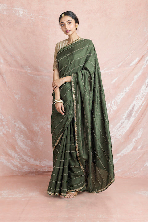 Shop gorgeous mehendi green embroidered mysore silk saree online in USA with cream color embroidered saree blouse. Champion ethnic fashion on weddings and festivals with a stunning collection of designer sarees, handloom sarees with blouse, wedding sarees, from Pure Elegance Indian fashion store in USA.-full view