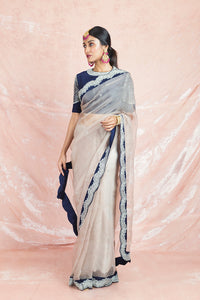 Shop beautiful cream embroidered organza saree online in USA with blue embroidered saree blouse. Champion ethnic fashion on weddings and festivals with a stunning collection of designer sarees, handloom sarees with blouse, wedding sarees, from Pure Elegance Indian fashion store in USA.-full view