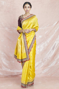 Shop stunning yellow embroidered handloom sari online in USA with brown embroidered saree blouse. Champion ethnic fashion on weddings and festivals with a stunning collection of designer sarees, handloom sarees with blouse, wedding sarees, from Pure Elegance Indian fashion store in USA.-full view