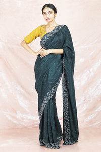 Shop beautiful dark green embroidered silk saree online in USA with embroidered yellow saree blouse. Champion ethnic fashion on weddings and festivals with a stunning collection of silk sarees, handloom sarees with blouse, bridal sarees, from Pure Elegance Indian fashion store in USA.