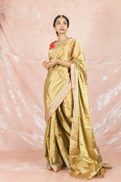 Shop gorgeous golden handloom saree online in USA with red bandhej saree blouse. Champion ethnic fashion on weddings and festivals with a stunning collection of Banarasi sarees, handloom sarees with blouse, bridal sarees, from Pure Elegance Indian fashion store in USA.-full view