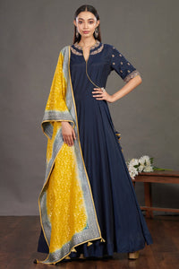 Buy gorgeous blue embroidered Anarkali gown online in USA with yellow dupatta. Make a fashion statement on festive occasions and weddings with designer suits, Indian dresses, Anarkali suits, palazzo suits, designer gowns, sharara suits from Pure Elegance Indian fashion store in USA.-front
