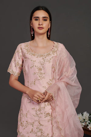 Shop stunning powder pink embroidered sharara suit online in USA with dupatta. Make a fashion statement on festive occasions and weddings with designer suits, Indian dresses, Anarkali suits, palazzo suits, designer gowns, sharara suits from Pure Elegance Indian fashion store in USA.-closeup