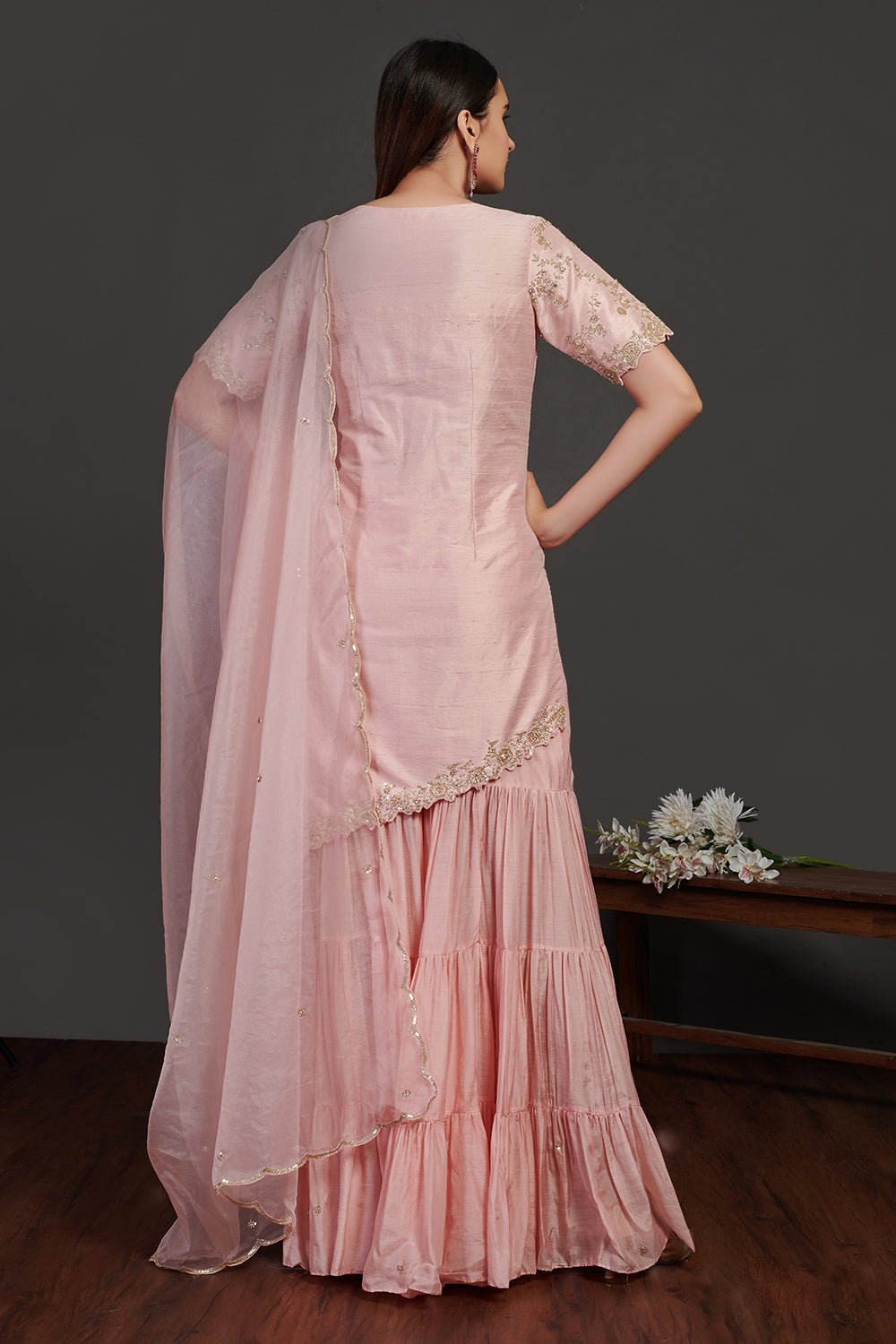 Shop stunning powder pink embroidered sharara suit online in USA with dupatta. Make a fashion statement on festive occasions and weddings with designer suits, Indian dresses, Anarkali suits, palazzo suits, designer gowns, sharara suits from Pure Elegance Indian fashion store in USA.-back