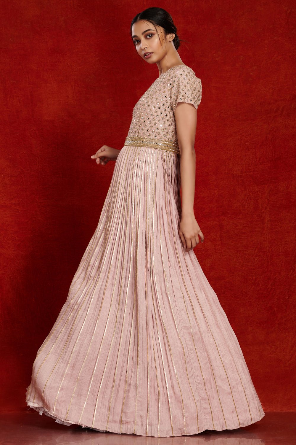 Shop stunning powder pink fit and flare mirror work gown online in USA. Make a fashion statement on festive occasions and weddings with designer suits, Indian dresses, Anarkali suits, palazzo suits, designer gowns, sharara suits from Pure Elegance Indian fashion store in USA.-side