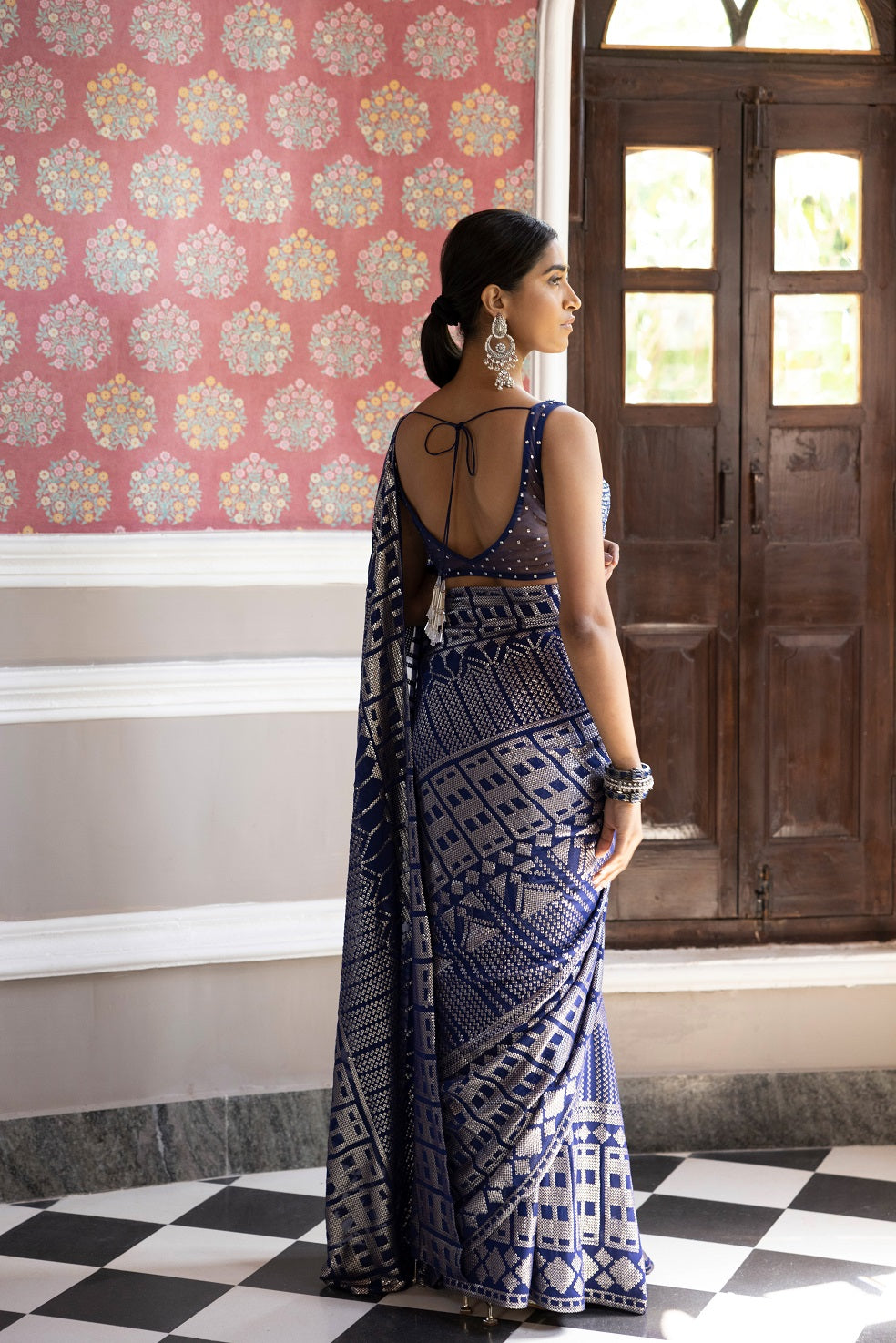 Shop Beautiful blue & silver embroidered saree. It comes with a sequined work all over and a sleeveless sequined blouse. It is best suited for night parties & weddings. Make a fashion statement on festive occasions and weddings with designer sarees, designer suits, Indian dresses, Anarkali suits, palazzo suits, designer gowns, sharara suits, and embroidered sarees from Pure Elegance Indian fashion store in USA.