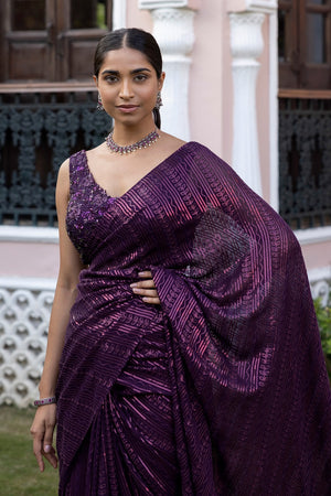 Shop a Beautiful wine sequin embroidered saree. It comes with a sequined work all over and a sleeveless sequined blouse. It is best suited for night parties & weddings. Make a fashion statement on festive occasions and weddings with designer sarees, designer suits, Indian dresses, Anarkali suits, palazzo suits, designer gowns, sharara suits, and embroidered sarees from Pure Elegance Indian fashion store in the USA.