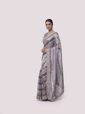 Buy beautiful two-tone silver embroidered handloom saree online in USA with blouse. Make a fashion statement on festive occasions and weddings with designer sarees, designer suits, Indian dresses, Anarkali suits, palazzo suits, designer gowns, sharara suits, embroidered sarees from Pure Elegance Indian fashion store in USA.-side