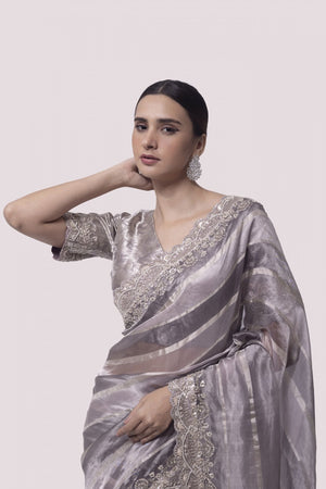 Buy beautiful two-tone silver embroidered handloom saree online in USA with blouse. Make a fashion statement on festive occasions and weddings with designer sarees, designer suits, Indian dresses, Anarkali suits, palazzo suits, designer gowns, sharara suits, embroidered sarees from Pure Elegance Indian fashion store in USA.-closeup
