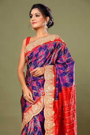 Buy purple Patola silk saree online in USA with red scalloped border. Make a fashion statement at weddings with stunning designer sarees, embroidered sarees with blouse, wedding sarees, handloom sarees from Pure Elegance Indian fashion store in USA.-side