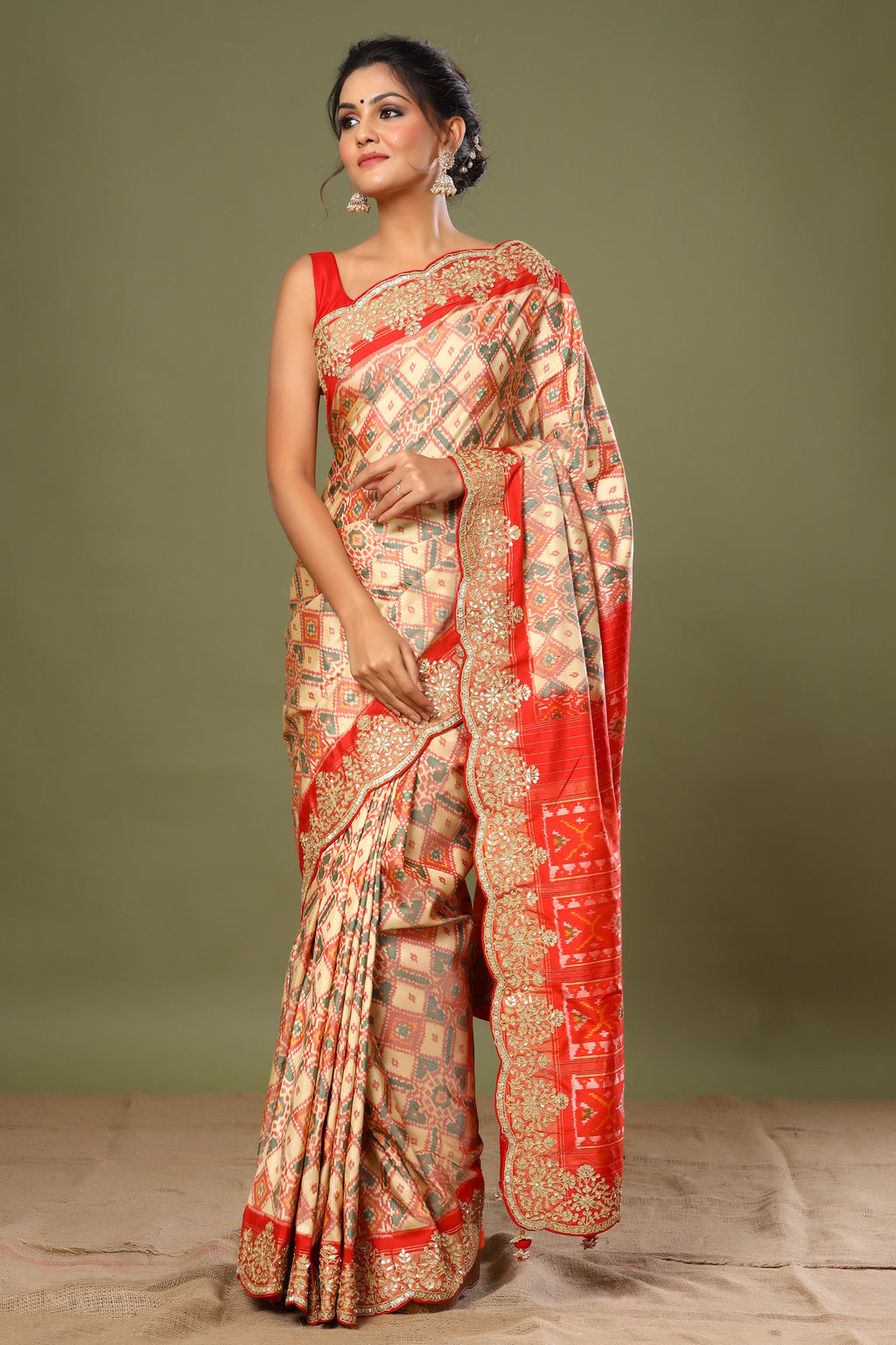 Shop cream Patola silk saree online in USA with scalloped border. Make a fashion statement at weddings with stunning designer sarees, embroidered sarees with blouse, wedding sarees, handloom sarees from Pure Elegance Indian fashion store in USA.-full view