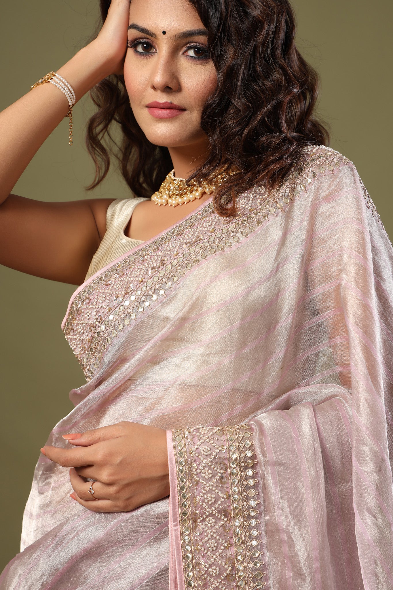 Buy lilac tissue silk saree online in USA with embroidered border. Make a fashion statement at weddings with stunning designer sarees, embroidered sarees with blouse, wedding sarees, handloom sarees from Pure Elegance Indian fashion store in USA.-closeup