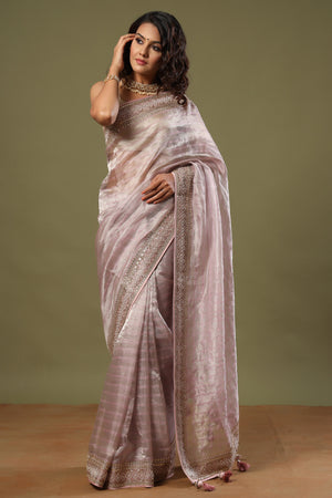 Buy lilac tissue silk saree online in USA with embroidered border. Make a fashion statement at weddings with stunning designer sarees, embroidered sarees with blouse, wedding sarees, handloom sarees from Pure Elegance Indian fashion store in USA.-front