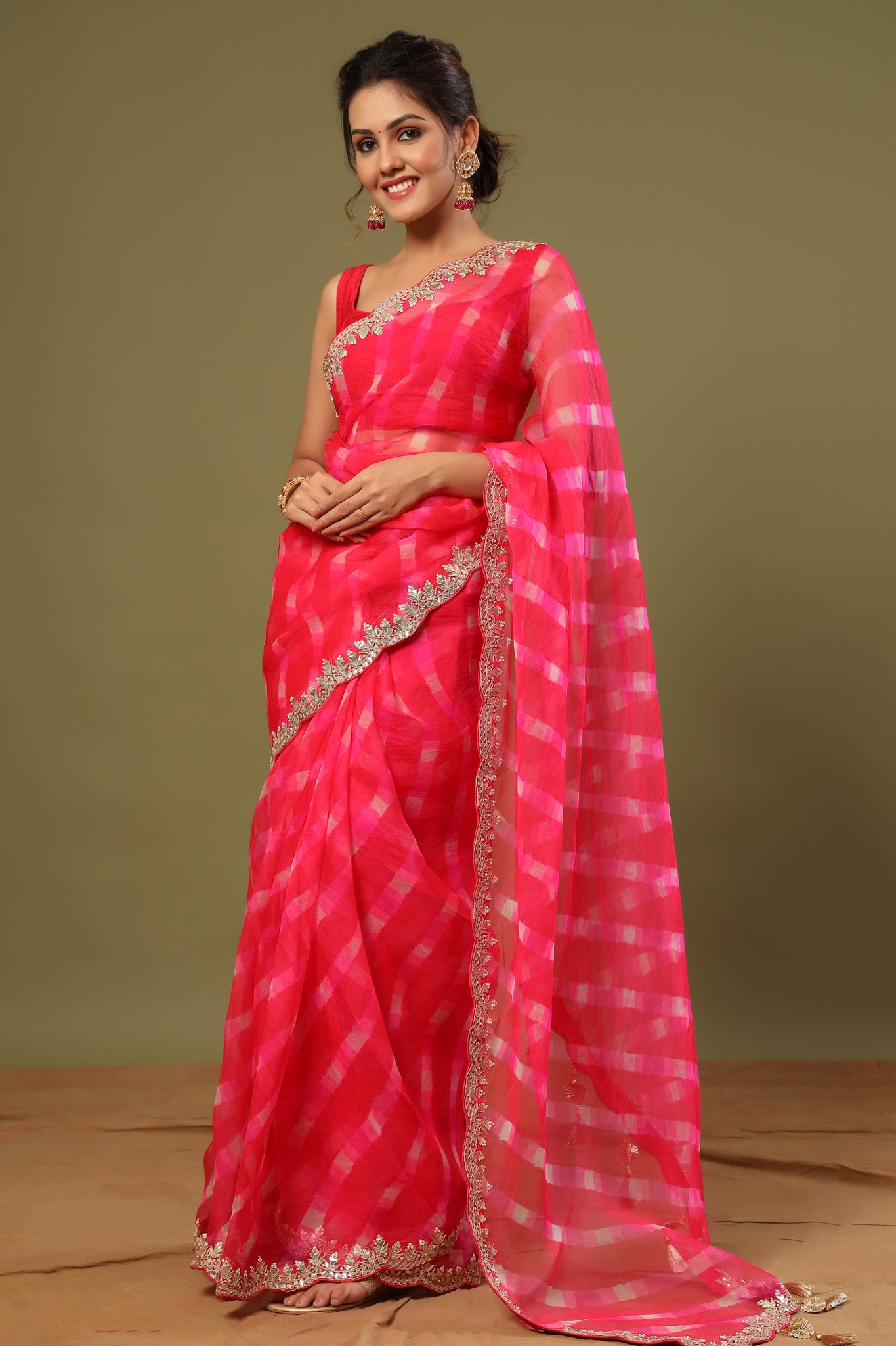 Shop rani pink heavy embroidery organza silk saree online in USA with scalloped border. Make a fashion statement at weddings with stunning designer sarees, embroidered sarees with blouse, wedding sarees, handloom sarees from Pure Elegance Indian fashion store in USA.-pallu
