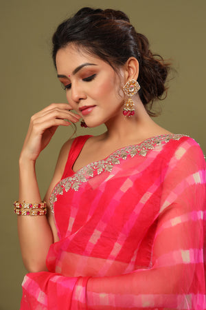 Shop rani pink heavy embroidery organza silk saree online in USA with scalloped border. Make a fashion statement at weddings with stunning designer sarees, embroidered sarees with blouse, wedding sarees, handloom sarees from Pure Elegance Indian fashion store in USA.-closeup