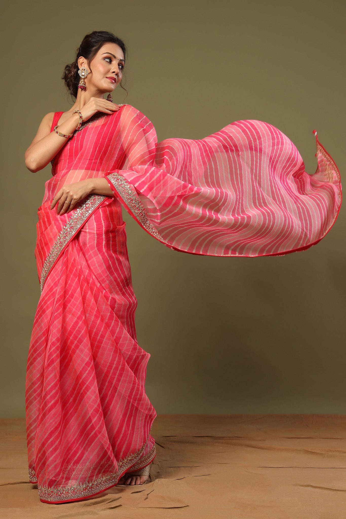 Shop pink striped organza silk saree online in USA with embroidered border. Make a fashion statement at weddings with stunning designer sarees, embroidered sarees with blouse, wedding sarees, handloom sarees from Pure Elegance Indian fashion store in USA.-pallu