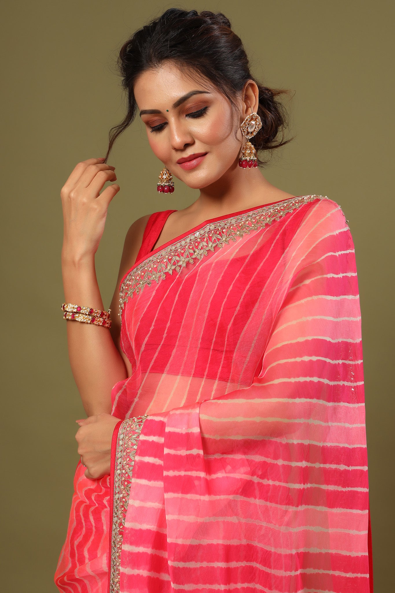 Shop pink striped organza silk saree online in USA with embroidered border. Make a fashion statement at weddings with stunning designer sarees, embroidered sarees with blouse, wedding sarees, handloom sarees from Pure Elegance Indian fashion store in USA.-embroidery