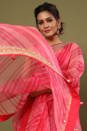 Shop pink striped organza silk saree online in USA with embroidered border. Make a fashion statement at weddings with stunning designer sarees, embroidered sarees with blouse, wedding sarees, handloom sarees from Pure Elegance Indian fashion store in USA.-saree