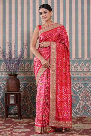 Buy pink Patola silk sari online in USA with embroidered border. Make a fashion statement at weddings with stunning designer sarees, embroidered sarees with blouse, wedding sarees, handloom sarees from Pure Elegance Indian fashion store in USA.-front