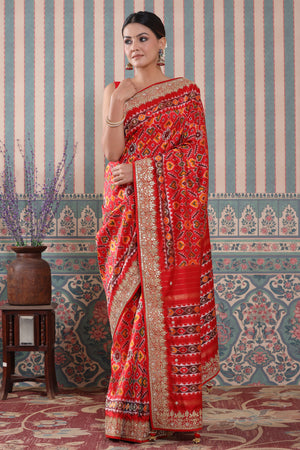Shop red Patola silk sari online in USA with embroidered border. Make a fashion statement at weddings with stunning designer sarees, embroidered sarees with blouse, wedding sarees, handloom sarees from Pure Elegance Indian fashion store in USA.-front