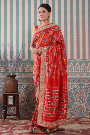 Shop red Patola silk sari online in USA with embroidered border. Make a fashion statement at weddings with stunning designer sarees, embroidered sarees with blouse, wedding sarees, handloom sarees from Pure Elegance Indian fashion store in USA.-pallu