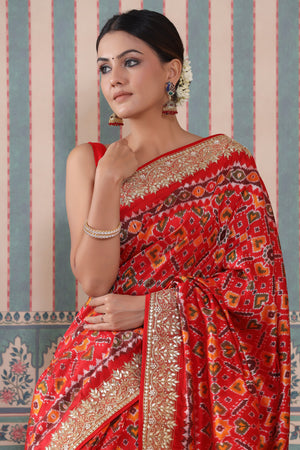 Shop red Patola silk sari online in USA with embroidered border. Make a fashion statement at weddings with stunning designer sarees, embroidered sarees with blouse, wedding sarees, handloom sarees from Pure Elegance Indian fashion store in USA.-embroidery