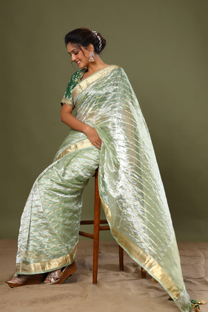 Buy green striped tissue silk sari online in USA with saree blouse. Make a fashion statement at weddings with stunning designer sarees, embroidered sarees with blouse, wedding sarees, handloom sarees from Pure Elegance Indian fashion store in USA.-pallu