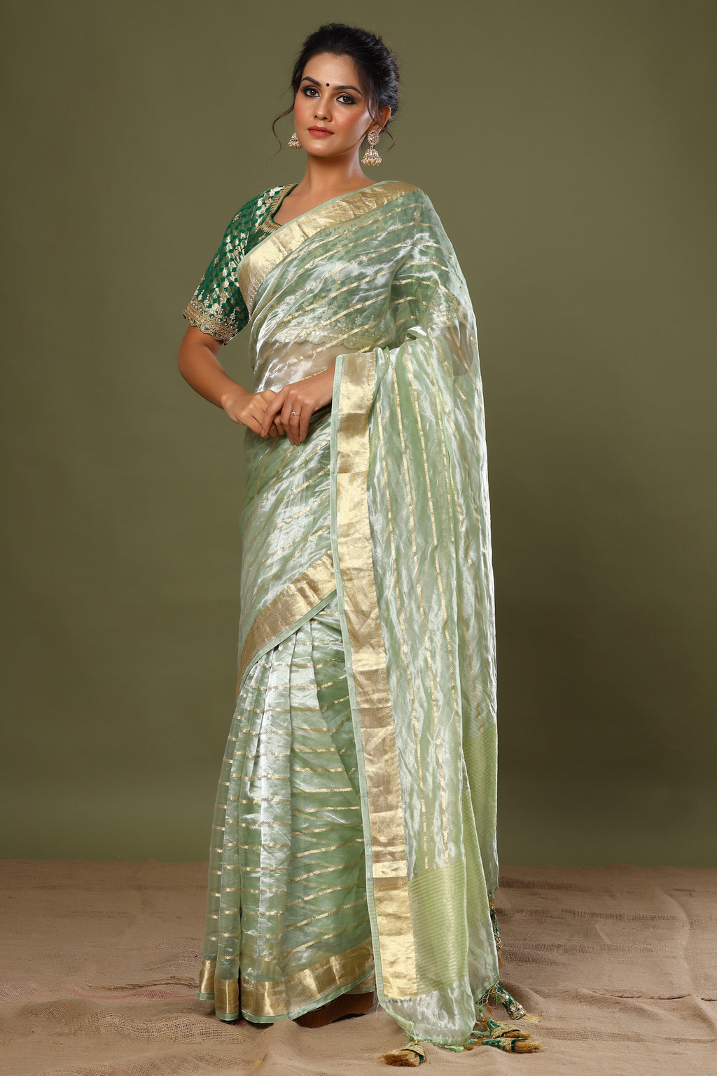 Buy green striped tissue silk sari online in USA with saree blouse. Make a fashion statement at weddings with stunning designer sarees, embroidered sarees with blouse, wedding sarees, handloom sarees from Pure Elegance Indian fashion store in USA.-full view