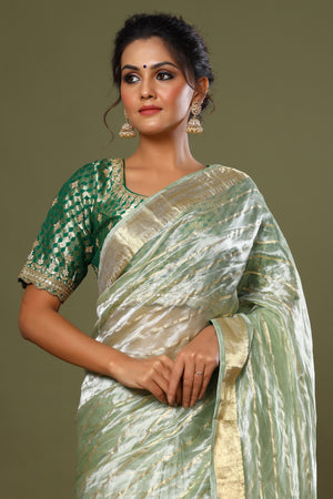 Buy green striped tissue silk sari online in USA with saree blouse. Make a fashion statement at weddings with stunning designer sarees, embroidered sarees with blouse, wedding sarees, handloom sarees from Pure Elegance Indian fashion store in USA.-closeup