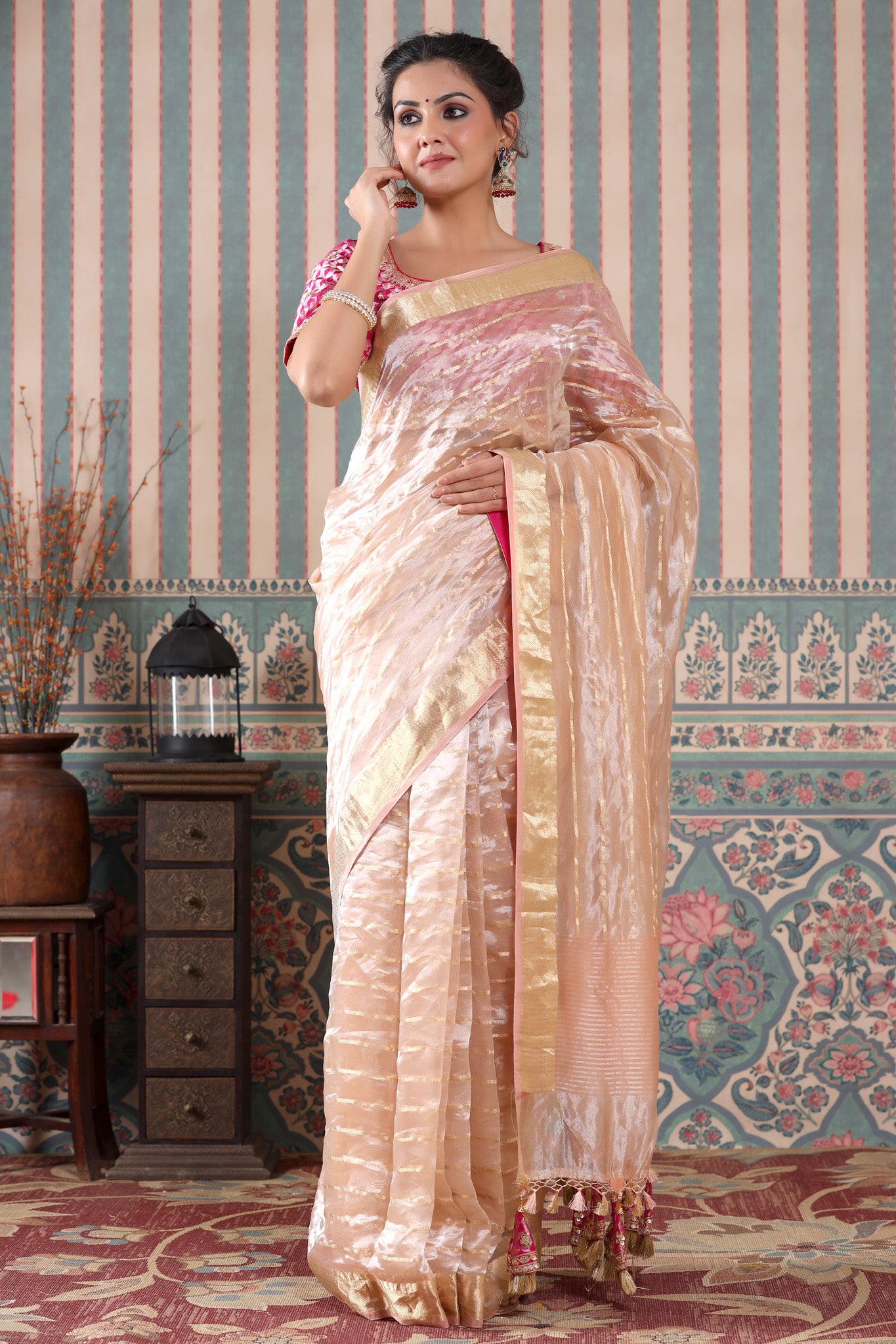 Buy rose gold striped tissue silk sari online in USA with pink saree blouse. Make a fashion statement at weddings with stunning designer sarees, embroidered sarees with blouse, wedding sarees, handloom sarees from Pure Elegance Indian fashion store in USA.-front