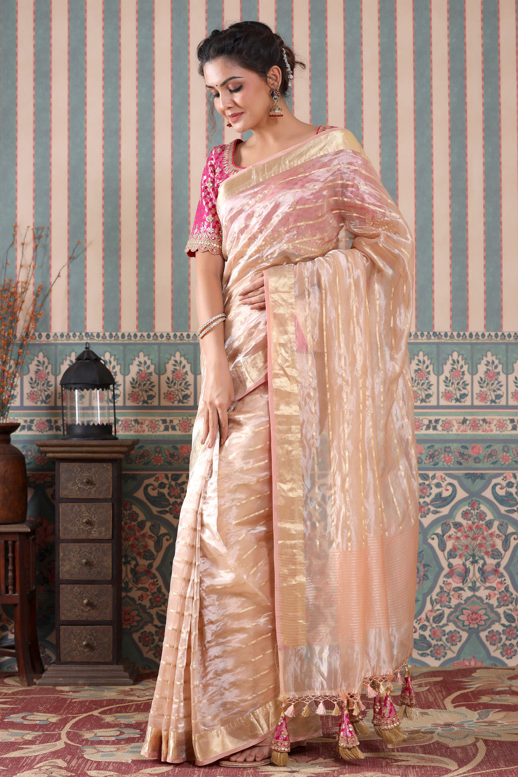 Buy rose gold striped tissue silk sari online in USA with pink saree blouse. Make a fashion statement at weddings with stunning designer sarees, embroidered sarees with blouse, wedding sarees, handloom sarees from Pure Elegance Indian fashion store in USA.-full view