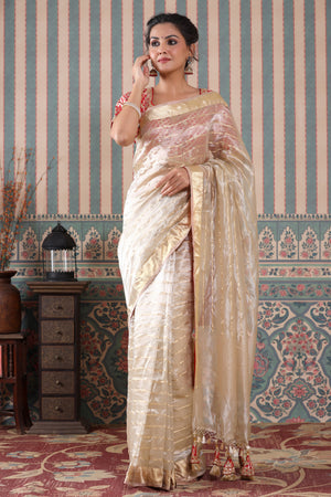 Shop golden striped tissue silk sari online in USA with red saree blouse. Make a fashion statement at weddings with stunning designer sarees, embroidered sarees with blouse, wedding sarees, handloom sarees from Pure Elegance Indian fashion store in USA.-front