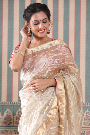 Shop golden striped tissue silk sari online in USA with red saree blouse. Make a fashion statement at weddings with stunning designer sarees, embroidered sarees with blouse, wedding sarees, handloom sarees from Pure Elegance Indian fashion store in USA.-closeup