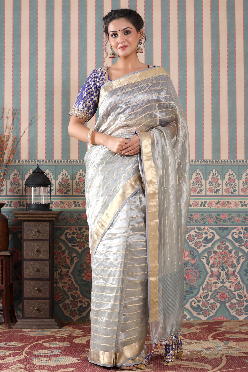 Buy grey striped tissue silk sari online in USA with blue saree blouse. Make a fashion statement at weddings with stunning designer sarees, embroidered sarees with blouse, wedding sarees, handloom sarees from Pure Elegance Indian fashion store in USA.-full view