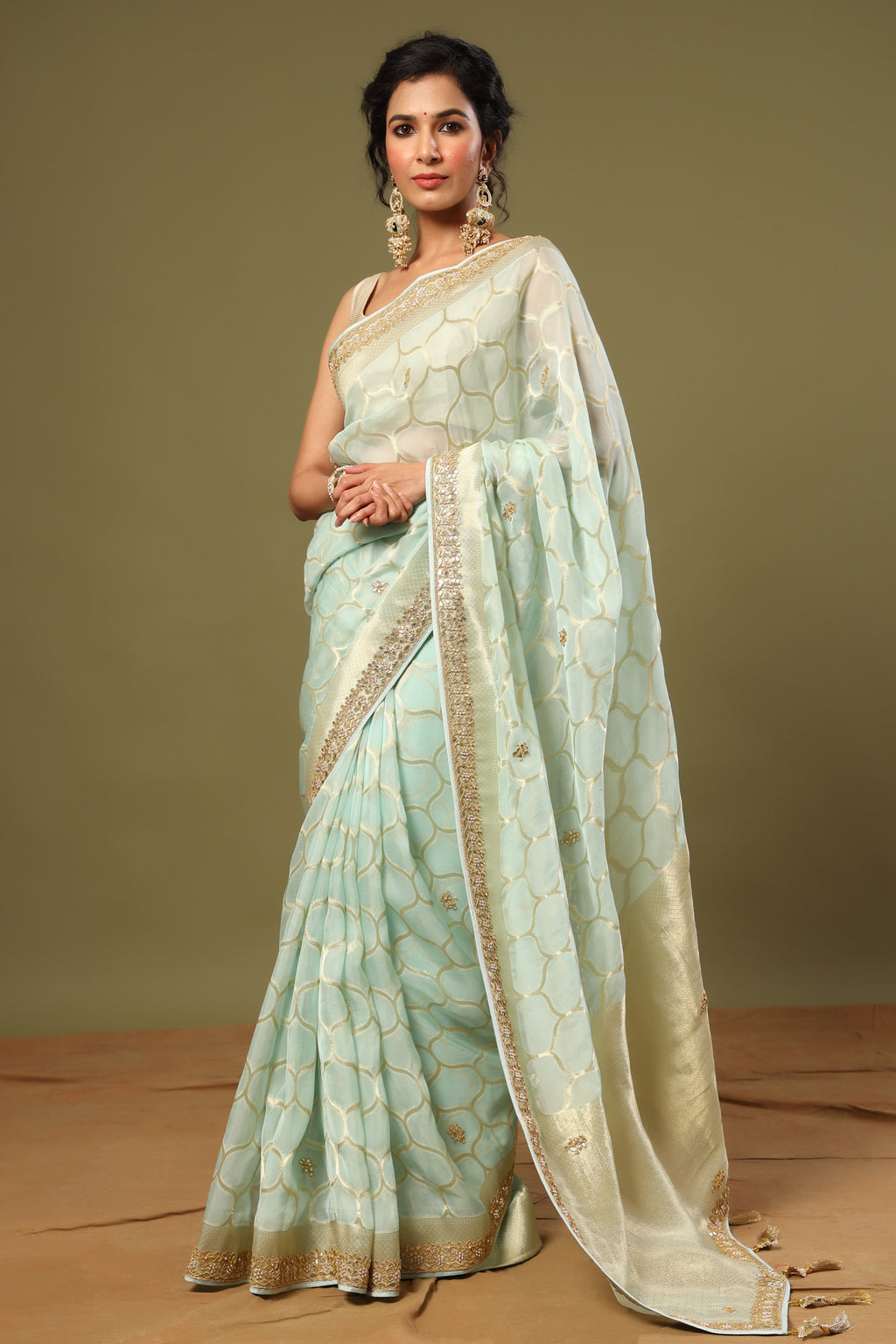 Shop mint green embroidered organza sari online in USA with zari jaal. Make a fashion statement at weddings with stunning designer sarees, embroidered sarees with blouse, wedding sarees, handloom sarees from Pure Elegance Indian fashion store in USA.-full view
