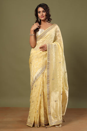 Shop lemon yellow embroidered organza sari online in USA with zari jaal. Make a fashion statement at weddings with stunning designer sarees, embroidered sarees with blouse, wedding sarees, handloom sarees from Pure Elegance Indian fashion store in USA.-front