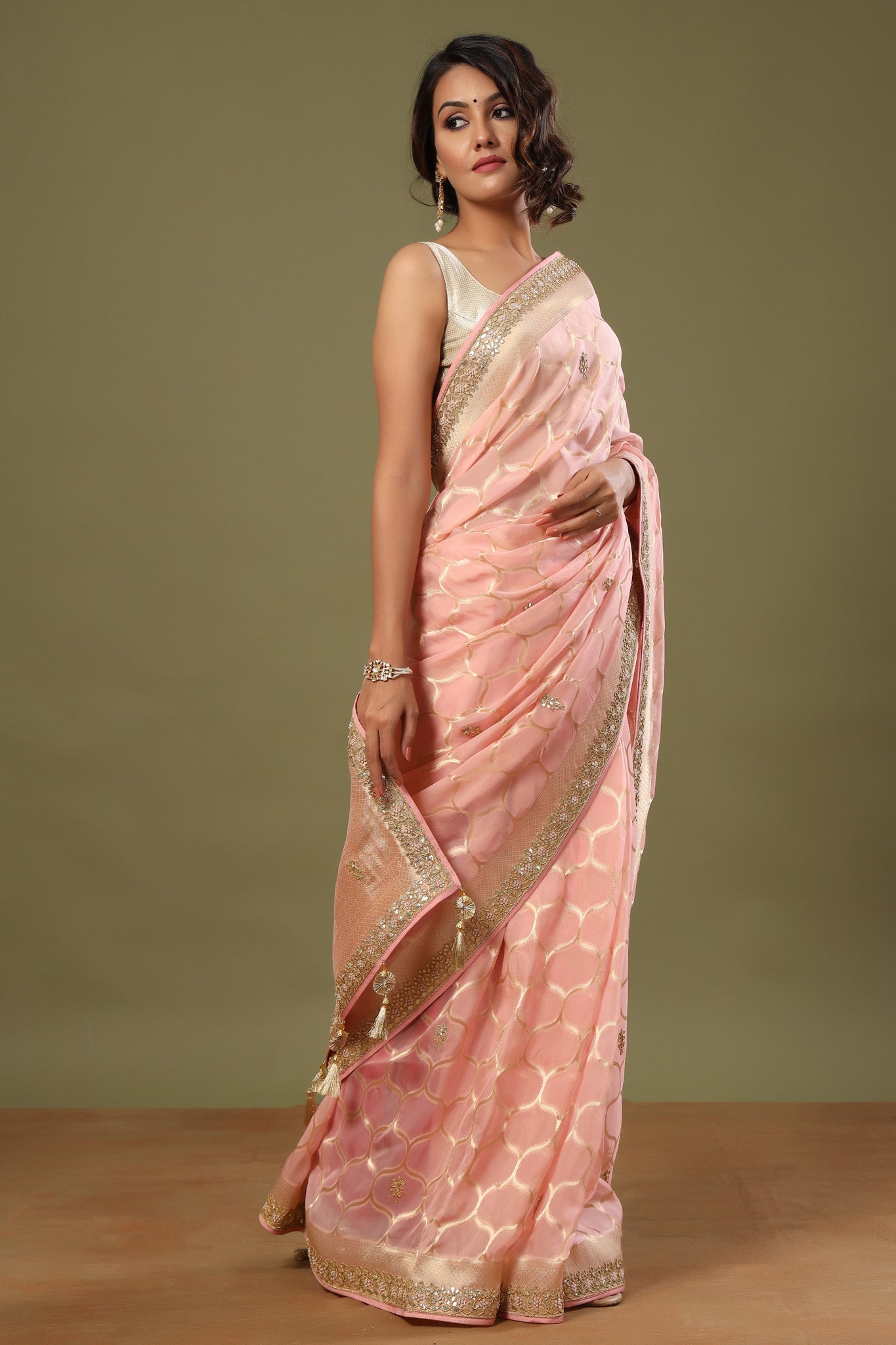 Buy light pink embroidered organza sari online in USA with zari jaal. Make a fashion statement at weddings with stunning designer sarees, embroidered sarees with blouse, wedding sarees, handloom sarees from Pure Elegance Indian fashion store in USA.-side