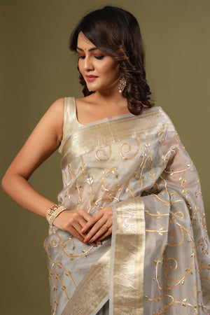 Buy grey gota work organza sari online in USA with zari work. Make a fashion statement at weddings with stunning designer sarees, embroidered sarees with blouse, wedding sarees, handloom sarees from Pure Elegance Indian fashion store in USA.-closeup