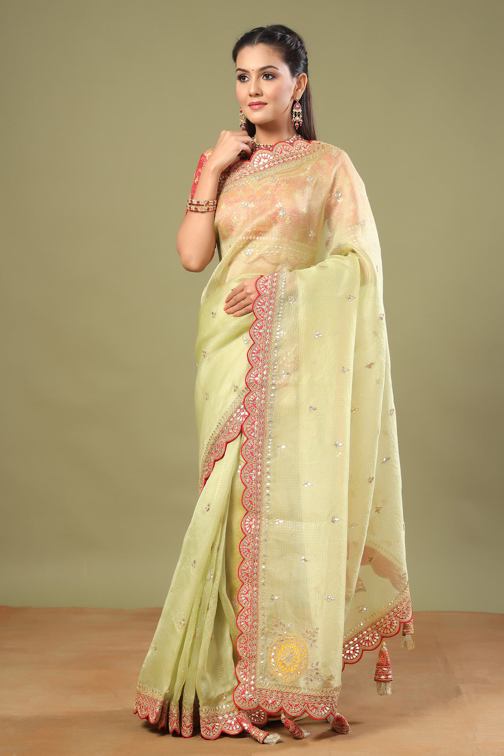 Shop pista green organza sari online in USA with red saree blouse. Make a fashion statement at weddings with stunning designer sarees, embroidered sarees with blouse, wedding sarees, handloom sarees from Pure Elegance Indian fashion store in USA.-full view