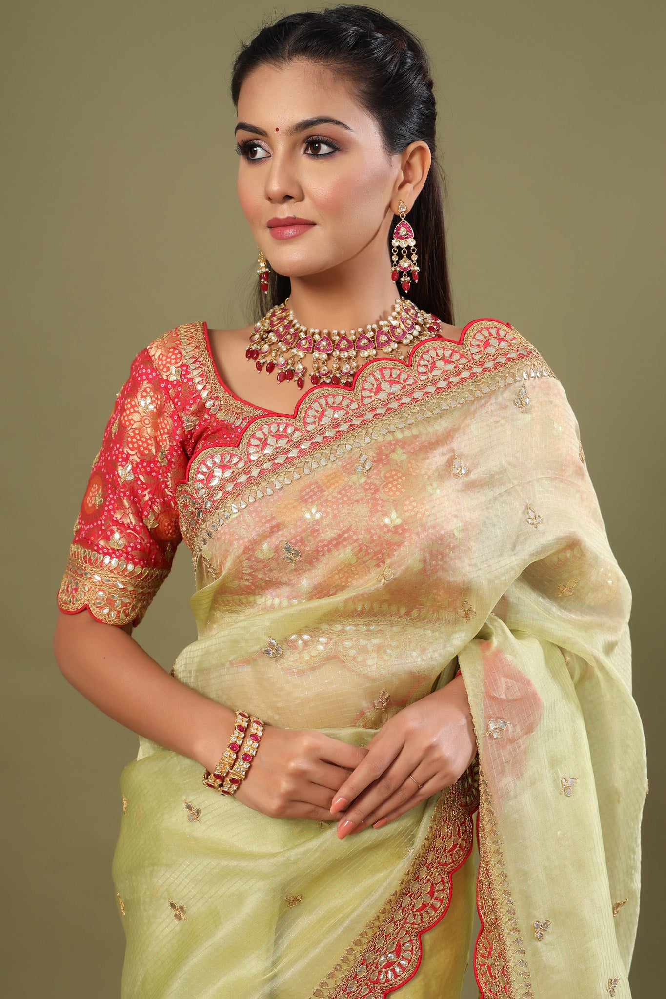 Shop pista green organza sari online in USA with red saree blouse. Make a fashion statement at weddings with stunning designer sarees, embroidered sarees with blouse, wedding sarees, handloom sarees from Pure Elegance Indian fashion store in USA.-saree
