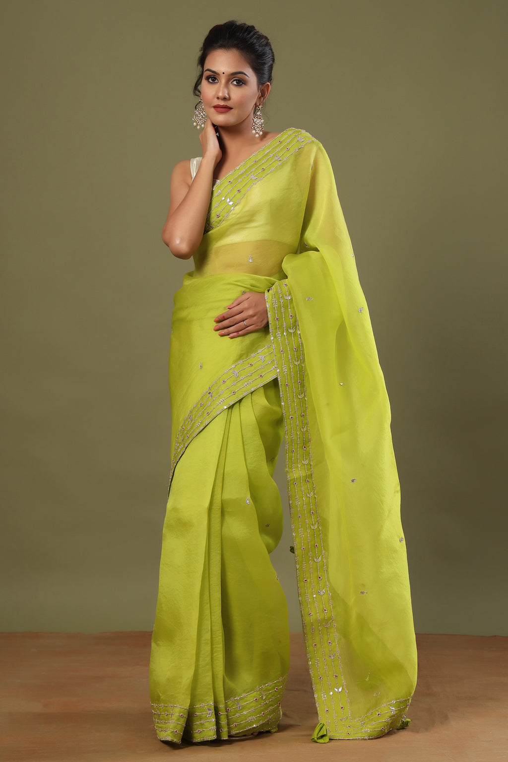 Buy pista green organza sari online in USA with embroidered border. Make a fashion statement at weddings with stunning designer sarees, embroidered sarees with blouse, wedding sarees, handloom sarees from Pure Elegance Indian fashion store in USA.-full view