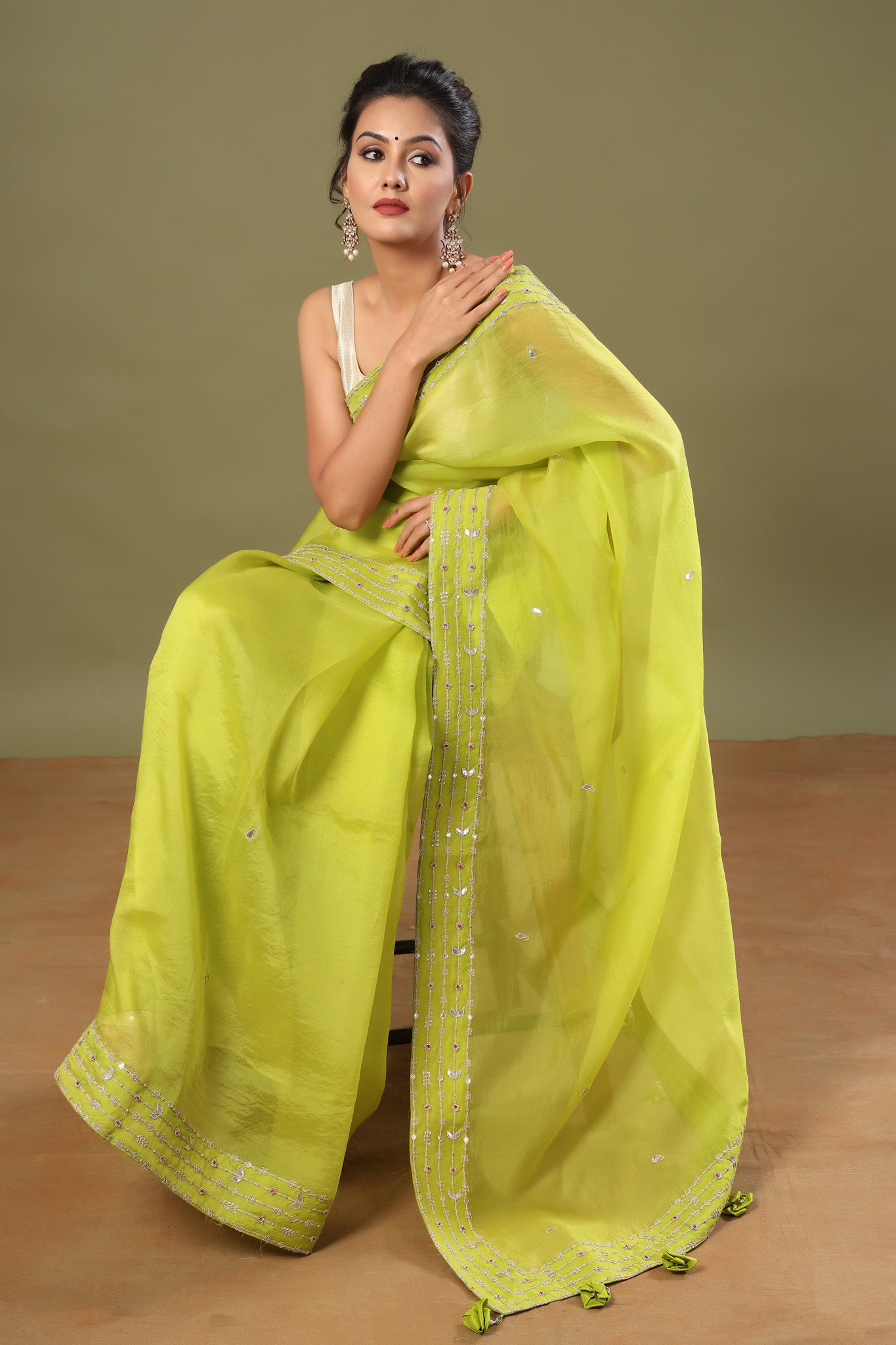 Buy pista green organza sari online in USA with embroidered border. Make a fashion statement at weddings with stunning designer sarees, embroidered sarees with blouse, wedding sarees, handloom sarees from Pure Elegance Indian fashion store in USA.-pallu