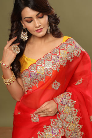 Buy stunning red hand embroidered organza sari online in USA. Make a fashion statement at weddings with stunning designer sarees, embroidered sarees with blouse, wedding sarees, handloom sarees from Pure Elegance Indian fashion store in USA.-closeup