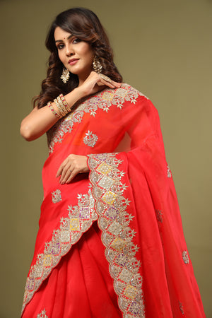 Buy stunning red hand embroidered organza sari online in USA. Make a fashion statement at weddings with stunning designer sarees, embroidered sarees with blouse, wedding sarees, handloom sarees from Pure Elegance Indian fashion store in USA.-closeup