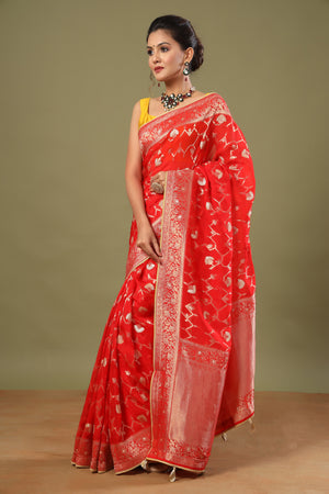 Shop stunning red Banarasi sari online in USA with zari work jaal. Make a fashion statement at weddings with stunning designer sarees, embroidered sarees with blouse, wedding sarees, handloom sarees from Pure Elegance Indian fashion store in USA.-saree